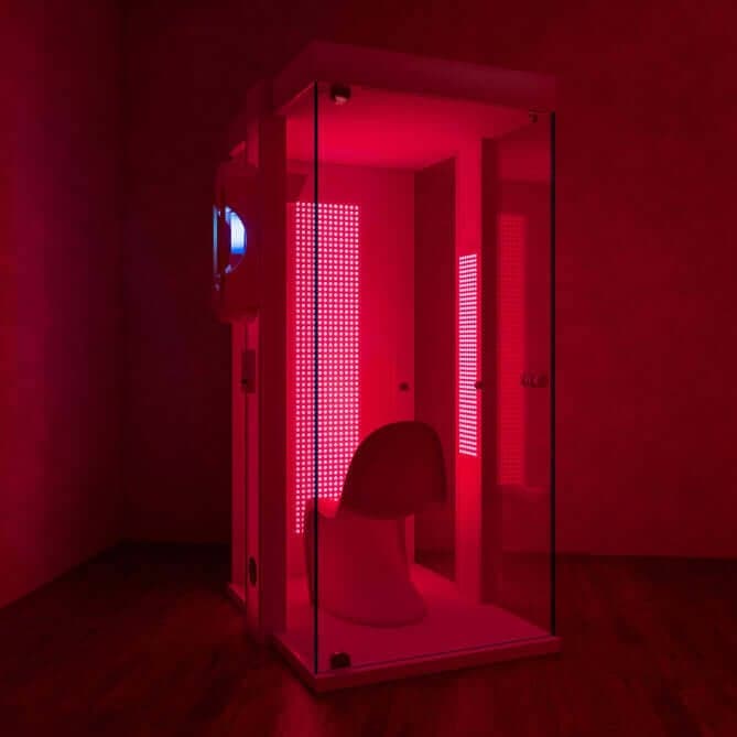 HaloRed therapy booth bathed in red light